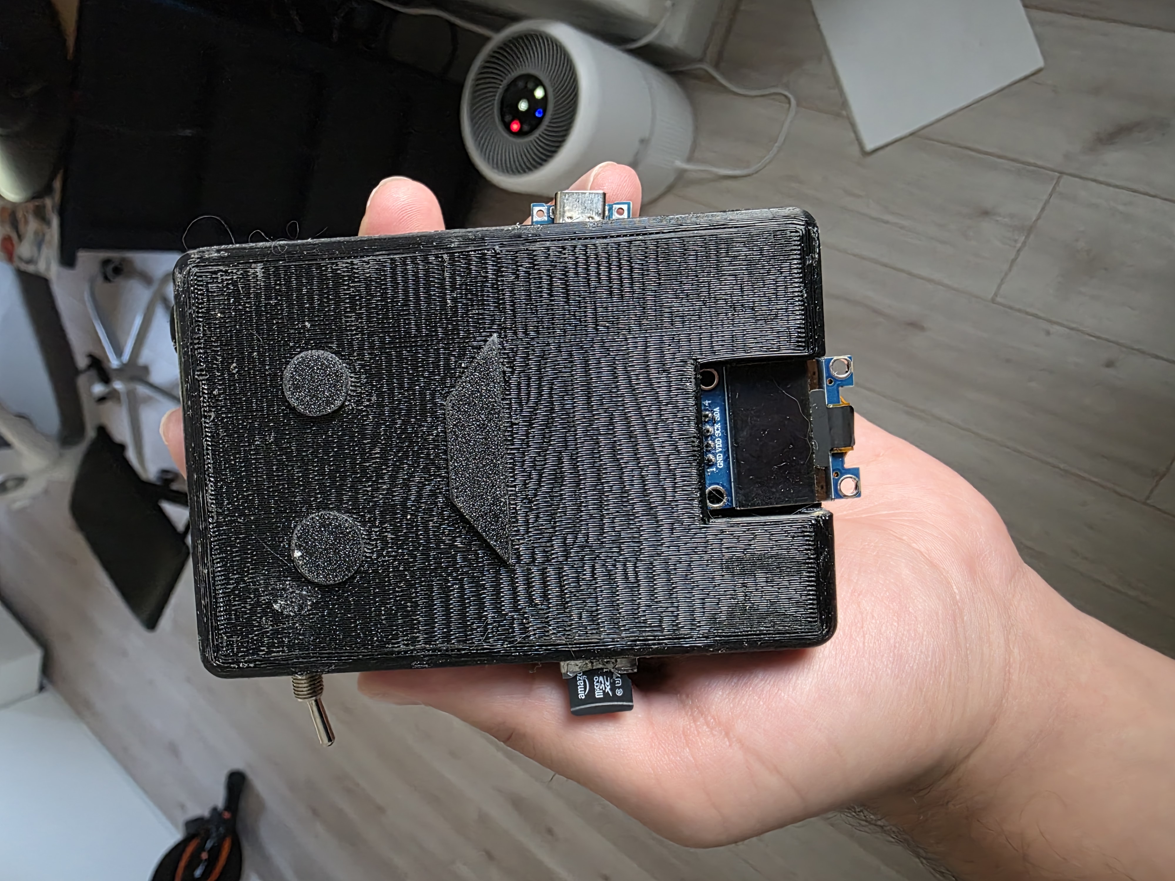 Assembled voice recorder enclosure held in hand